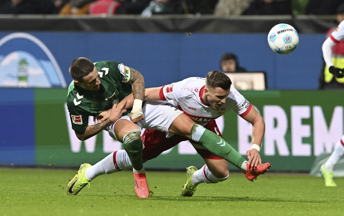 Werder's Marco Friedl, left, vies for the ball with Stuttgart's Ermedin Demirovic , during a German Bundesliga soccer match between Werder Bremen and VfB Stuttgart, in Bremen, Germany, Saturday, Nov. 30, 2024. (Carmen Jaspersen/dpa via AP)