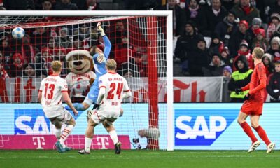 Munich's Konrad Laimer, right, scores during the Bundesliga soccer match between Bayern Munich and RB Leipzig at the Allianz Arena, Munich, Germany, Friday Dec. 20, 2024. (Tom Weller/dpa via AP)