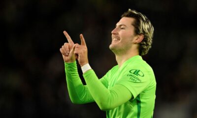 Wolfsburg's Jonas Wind celebrates scoring his side's second goal during a Bundesliga soccer match between Wolfsburg and Hoffenheim, at the Volkswagen Arena in Wolfsburg, Germany, Wednesday, Dec. 4, 2024. (Swen Pförtner/dpa via AP)
