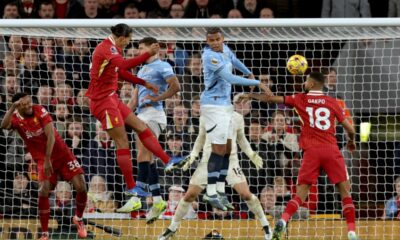 Liverpool's Virgil van Dijk, 2nd left, jumps to head the ball during the English Premier League soccer match between Liverpool and Manchester City at Anfield Stadium, Liverpool, England, Sunday Dec. 1, 2024. (AP Photo/Ian Hodgson)