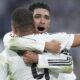 Real Madrid's Jude Bellingham, right, hugs to congratulate teammate Kylian Mbappe on scoring his side's second goal during the Spanish La Liga soccer match between Real Madrid and Getafe at the Santiago Bernabeu Stadium in Madrid, Spain, Sunday, Dec. 1, 2024. (AP Photo/Bernat Armangue)