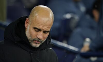 Manchester City's head coach Pep Guardiola waits for the start of the English Premier League soccer match between Manchester City and Nottingham Forest at the Etihad Stadium in Manchester, Wednesday, Dec. 4, 2024. (AP Photo/Dave Thompson)