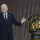 FILE - FIFA President Gianni Infantino' speaks next to the trophy during the draw for the 2025 FIFA Club World Cup soccer tournament, Thursday, Dec. 5, 2024, in Miami. (AP Photo/Rebecca Blackwell, File)