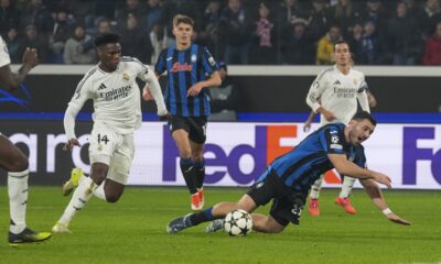 Atalanta's Sead Kolasinac, right, is fouled to earn his team a penalty kick during the Champions League opening phase soccer match between Atalanta and Real Madrid at the Bergamo's stadium, in Bergamo, Italy, Tuesday, Dec. 10, 2024. (AP Photo/Antonio Calanni)