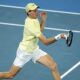 Jannik Sinner of Italy plays a forehand return to Ben Shelton of the U.S. during their semifinal match at the Australian Open tennis championship in Melbourne, Australia, Friday, Jan. 24, 2025. (AP Photo/Asanka Brendon Ratnayake)