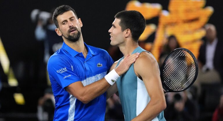 Novak Djokovic, left, of Serbia, is congratulated by Carlos Alcaraz of Spain following their quarterfinal match at the Australian Open tennis championship in Melbourne, Australia, Wednesday, Jan. 22, 2025. (AP Photo/Vincent Thian)