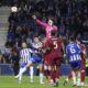 Roma's goalkeeper Mile Svilar punches the ball away during the Europa League playoff first leg soccer match between FC Porto and AS Roma at the Dragao stadium in Porto, Portugal, Thursday, Feb. 13, 2025. (AP Photo/Luis Vieira)