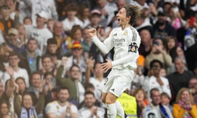 Real Madrid's Luka Modric celebrates after scoring the opening goal during the Spanish La Liga soccer match between Real Madrid and Girona at the Santiago Bernabeu stadium in Madrid, Spain, Sunday, Feb. 23, 2025. (AP Photo/Manu Fernandez)
