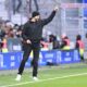 Hoffenheim's head coach Christian Ilzer points during the German Bundesliga soccer match between Werder Bremen and TSG 1899 Hoffenheim in Bremen, Germany, Sunday, Feb. 16, 2025.(Carmen Jaspersen/dpa via AP)