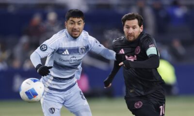 Sporting Kansas City midfielder Memo Rodríguez, left, and Inter Miami forward Lionel Messi compete for the ball during the first half of a CONCACAF Champions Cup soccer match, Wednesday, Feb. 19, 2025, in Kansas City, Kan. (AP Photo/Colin E. Braley)