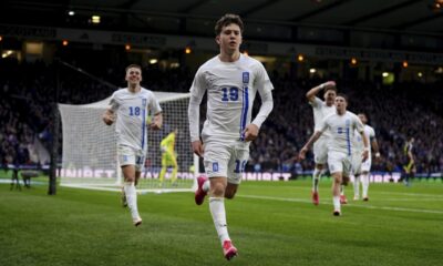 Greece's Konstantinos Karetsas celebrates scoring their side's second goal of the game during the UEFA Nations League play-offs, second leg soccer match between Scotland and Greece at Hampden Park, Glasgow, Scotland, Sunday March 23, 2025. (Andrew Milligan/PA via AP)