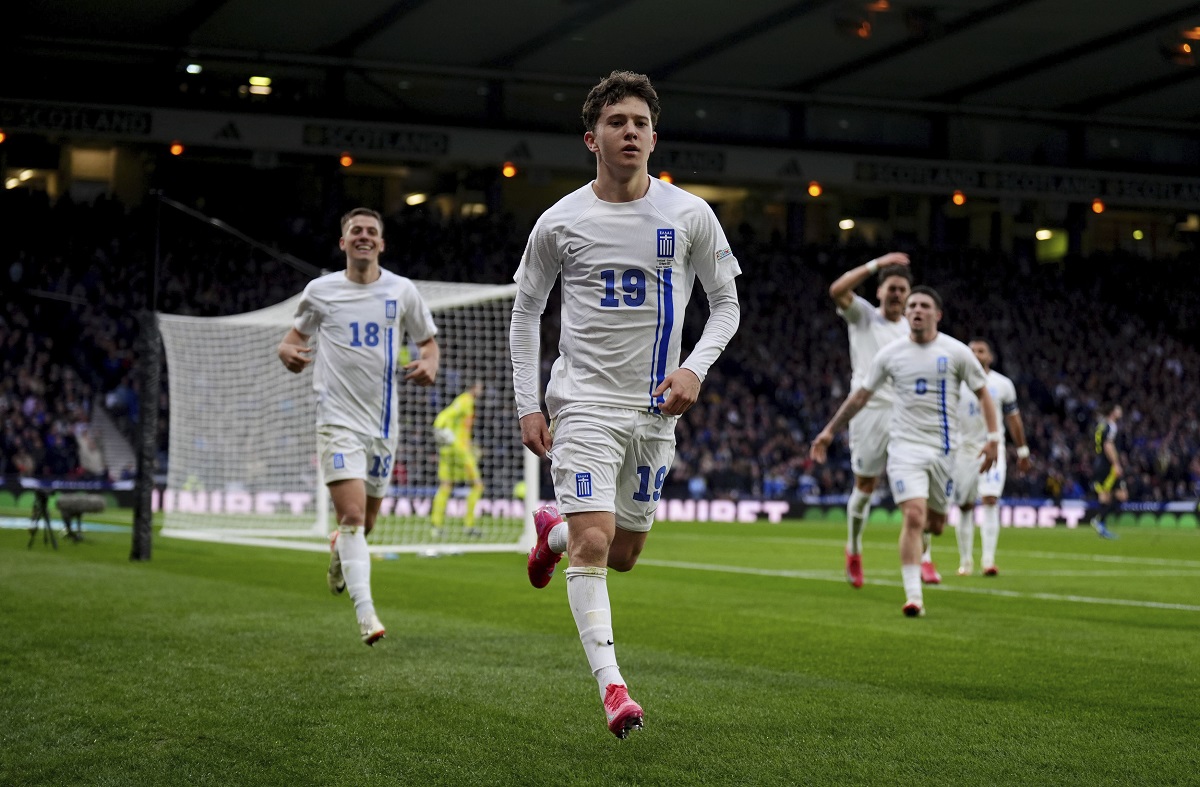 Greece's Konstantinos Karetsas celebrates scoring their side's second goal of the game during the UEFA Nations League play-offs, second leg soccer match between Scotland and Greece at Hampden Park, Glasgow, Scotland, Sunday March 23, 2025. (Andrew Milligan/PA via AP)