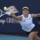 Iga Swiatek, of Poland, hits a return to Caroline Garcia, of France, during the Miami Open tennis tournament, Friday, March 21, 2025, in Miami Gardens, Fla. (AP Photo/Lynne Sladky)