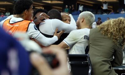 Panama's Cecilio Waterman Ruiz takes former French footballer Thierry Henry in his arm after he jumped on the nearby TV set after scoring against the United States during the second half of a CONCACAF Nations League semifinal soccer match Thursday, March 20, 2025, in Inglewood, Calif. (AP Photo/Etienne Laurent)