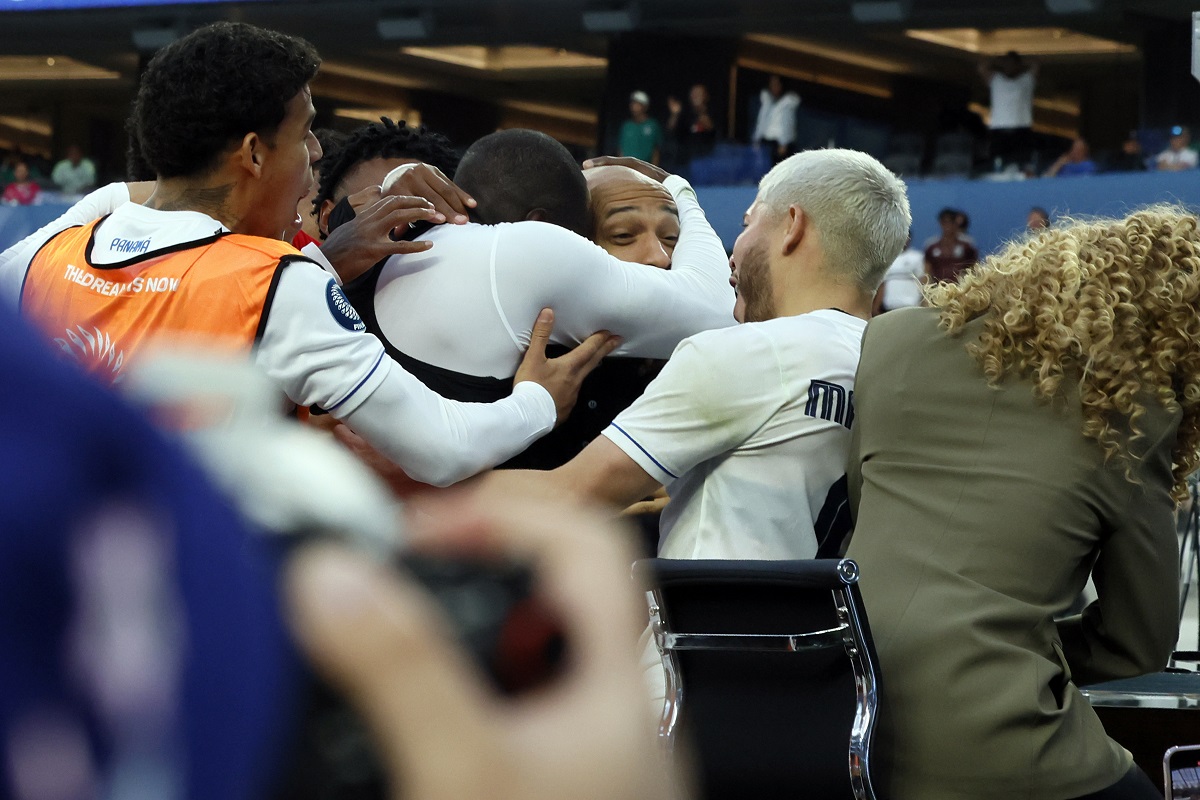 Panama's Cecilio Waterman Ruiz takes former French footballer Thierry Henry in his arm after he jumped on the nearby TV set after scoring against the United States during the second half of a CONCACAF Nations League semifinal soccer match Thursday, March 20, 2025, in Inglewood, Calif. (AP Photo/Etienne Laurent)