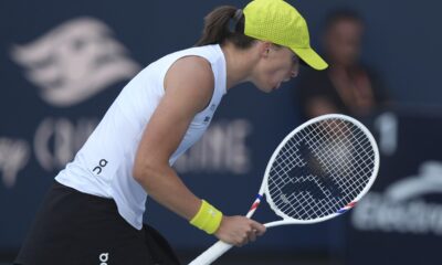 Iga Swiatek, of Poland, reacts after winning a point against Caroline Garcia, of France, during the Miami Open tennis tournament, Friday, March 21, 2025, in Miami Gardens, Fla. (AP Photo/Lynne Sladky)