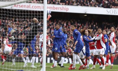 Chelsea's goalkeeper Robert Sanchez fails to save the goal from Arsenal's Mikel Merino during the English Premier League soccer match between Arsenal and Chelsea at Emirates stadium in London, Sunday, March 16, 2025. (AP Photo/Ian Walton)
