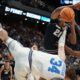 UCLA forward Tyler Bilodeau (34) collides with Utah State center Aubin Gateretse (21) during the first half in the first round of the NCAA college basketball tournament, Thursday, March 20, 2025, in Lexington, Ky. (AP Photo/Brynn Anderson)