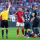 Bayern's Joao Palhinha is shown a red card by referee Christian Dingert during the German Bundesliga soccer match between Bayern Munich and VfL Bochum at the Allianz Arena in Munich, Germany, Saturday, March 8, 2025. (Sven Hoppe/dpa via AP)
