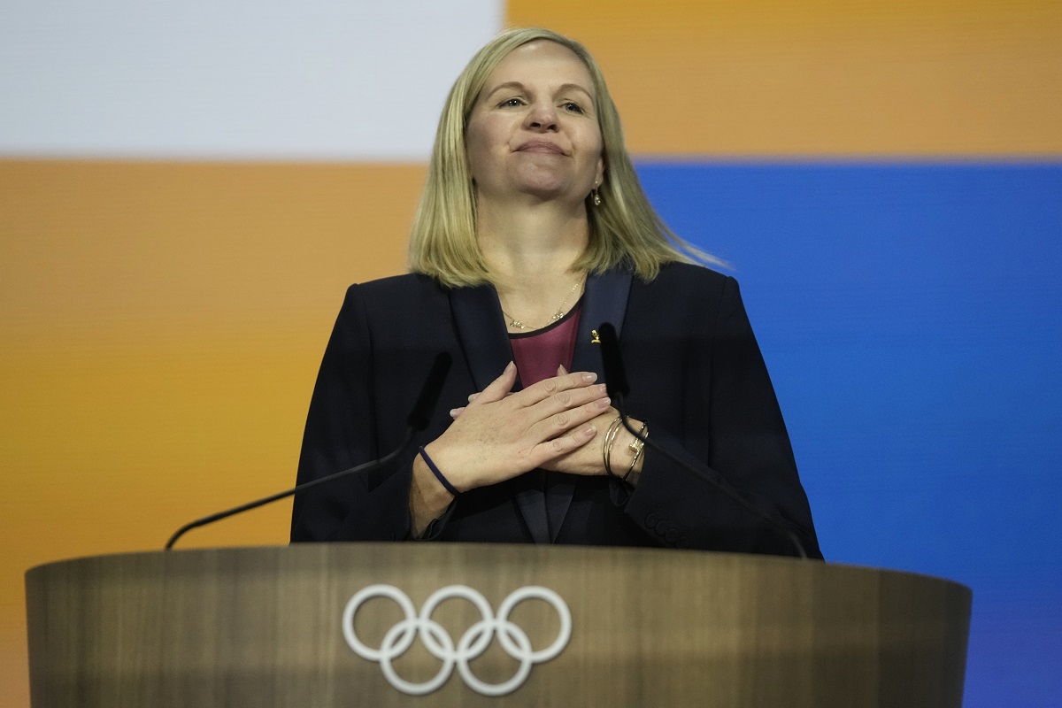 Kirsty Coventry reacts after she was announced as the new IOC President at the International Olympic Committee 144th session in Costa Navarino, western Greece, Thursday, March 20, 2025. (AP Photo/Thanassis Stavrakis)