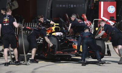Red Bull driver Liam Lawson of New Zealand gets pushed back into his garage during the sprint race ahead of the Chinese Formula One Grand Prix at the Shanghai International Circuit, Shanghai, Saturday, March 22, 2025. (Wu Hao/Pool Photo via AP)