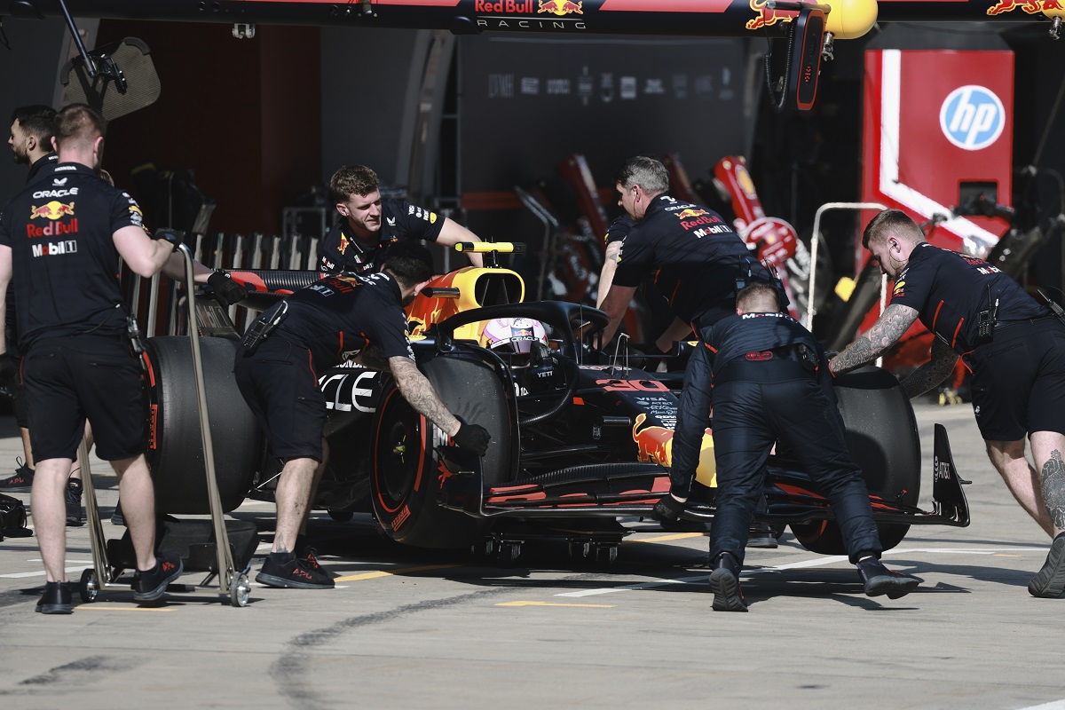 Red Bull driver Liam Lawson of New Zealand gets pushed back into his garage during the sprint race ahead of the Chinese Formula One Grand Prix at the Shanghai International Circuit, Shanghai, Saturday, March 22, 2025. (Wu Hao/Pool Photo via AP)