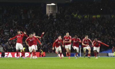 Nottingham Forest players celebrate victorty in in the penalty shoot-out following the English FA Cup quarter final soccer match between Brighton and Hove Albion and Nottingham Forrest, at the Amex Stadium, in Brighton and Hove, England, Saturday, March 29, 2025. (Adam Davy/PA via AP)