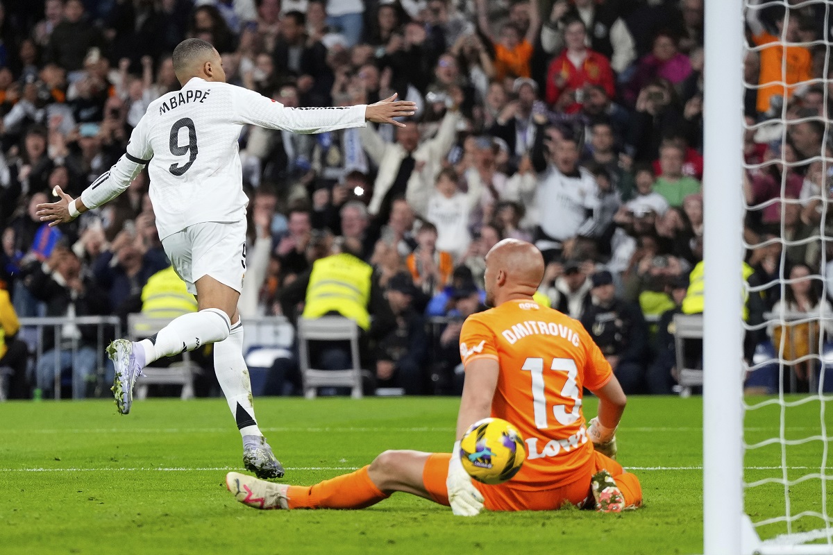 Real Madrid's Kylian Mbappe celebrates after scring from a penalty kick during a Spanish La Liga soccer match between Real Madrid and Leganes at the Santiago Bernabeu stadium in Madrid, Spain, Saturday, March 29, 2025. (AP Photo/Manu Fernandez)