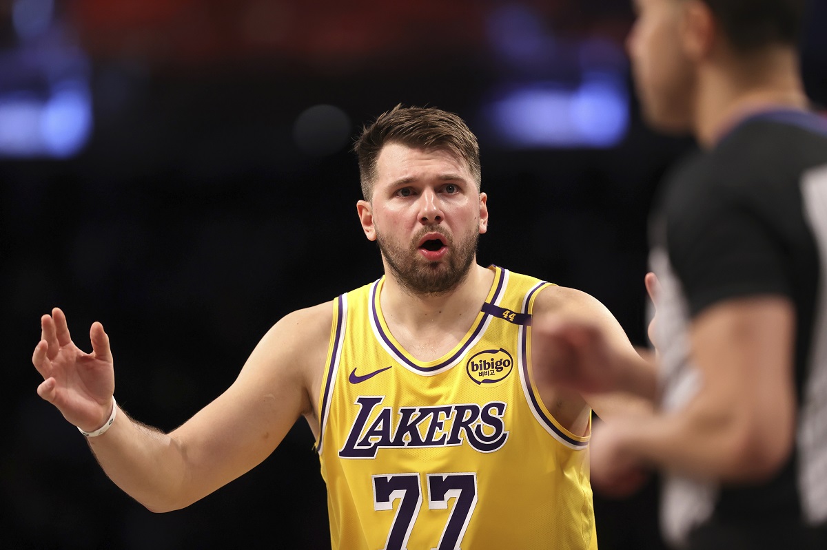 Los Angeles Lakers' Luka Doncic reacts after a foul was called on him during the first half of an NBA basketball game against the Brooklyn Nets, Monday, March 10, 2025, in New York. (AP Photo/Pamela Smith)