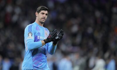 Real Madrid's goalkeeper Thibaut Courtois applauds fans at the end of the Champions League round of 16 first leg soccer match between Real Madrid and Atletico Madrid at the Bernebeu stadium in Madrid, Spain, Tuesday, March 4, 2025. (AP Photo/Manu Fernandez)
