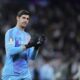 Real Madrid's goalkeeper Thibaut Courtois applauds fans at the end of the Champions League round of 16 first leg soccer match between Real Madrid and Atletico Madrid at the Bernebeu stadium in Madrid, Spain, Tuesday, March 4, 2025. (AP Photo/Manu Fernandez)