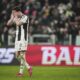 Juventus' Dusan Vlahovic reacts after missing his kick during a penalty shootout in an Italian Cup quarterfinal soccer match between Juventus and Empoli at the Allianz Stadium in Turin, Italy, Wednesday, Feb. 26, 2025 (Marco Alpozzi/LaPresse via AP)