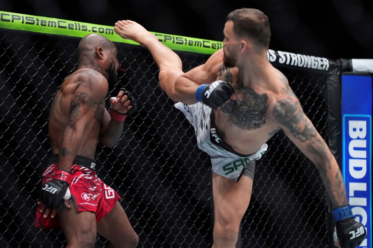 Mauricio Ruffy kicks King Green during a UFC 313 mixed martial arts lightweight bout Saturday, March 8, 2025, in Las Vegas. (AP Photo/John Locher)