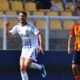 Como's Edoardo Goldaniga celebrates scoring during the Serie A soccer match between Lecce and Como 1907 at the Via del Mare Stadium in Lecce, Italy, Saturday, April 19, 2025. (Giovanni Evangelista/LaPresse via AP)