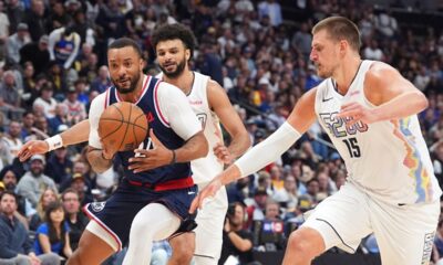 Los Angeles Clippers guard Norman Powell, front left, drives to the basket as Denver Nuggets guard Jamal Murray, back left, and center Nikola Jokic defend in the second half of Game 5 of an NBA basketball playoff series Tuesday, April 29, 2025, in Denver. (AP Photo/David Zalubowski)