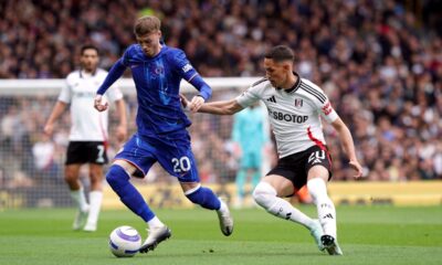 Chelsea's Cole Palmer, left and Fulham's Sasa Lukic vie for the ball, during the English Premier League soccer match between Fulham and Chelsea, at Craven Cottage, London, Sunday April 20, 2025. (Jonathan Brady/PA via AP)