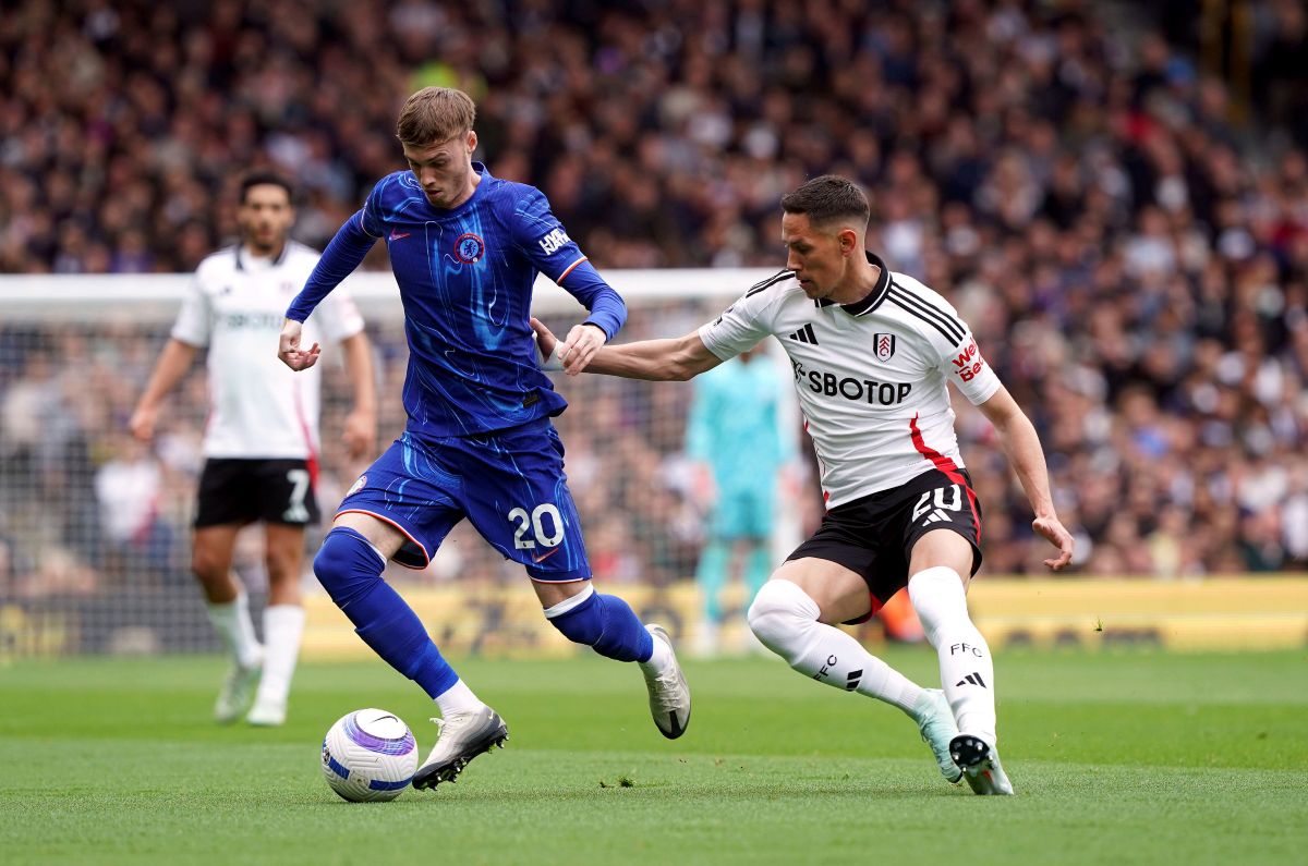 Chelsea's Cole Palmer, left and Fulham's Sasa Lukic vie for the ball, during the English Premier League soccer match between Fulham and Chelsea, at Craven Cottage, London, Sunday April 20, 2025. (Jonathan Brady/PA via AP)
