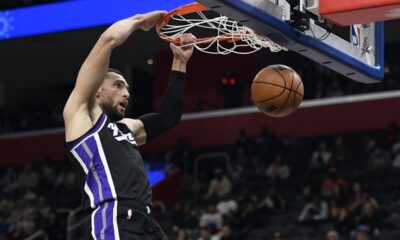 Sacramento Kings guard Zach LaVine dunks during the first half of an NBA basketball game against the Detroit Pistons, Monday, April 7, 2025, in Detroit. (AP Photo/Jose Juarez)
