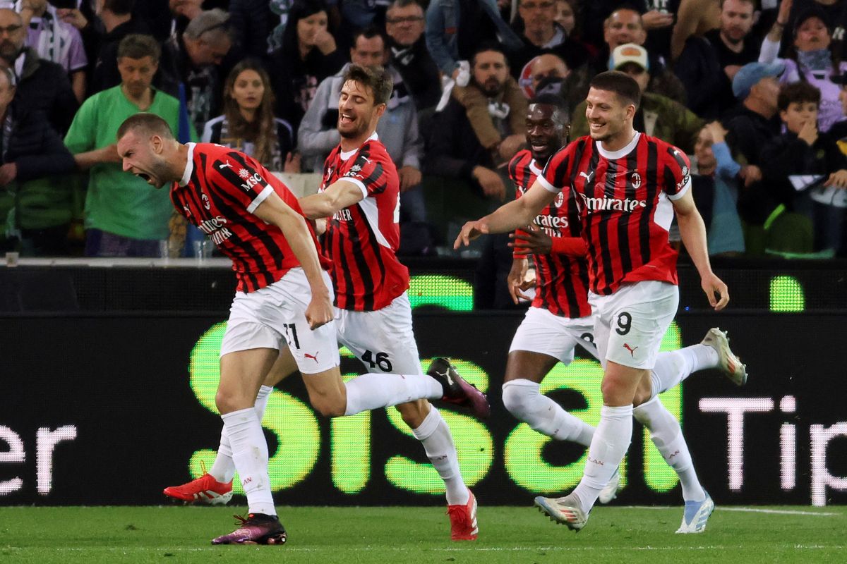 C Milan's Strahinja Pavlovic, left, celebrates scoring during the Serie A soccer match between Udinese and Milan at the Bluenergy Stadium in Udine, Italy, Friday April 11, 2025. (Andrea Bressanutti/LaPresse via AP)