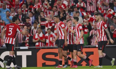 Athletic Bilbao players celebrate after Oihan Sancet, right, scored the opening goal during the Europa League quarter final second leg soccer match between Athletic Bilbao and Glasgow Rangers in Bilbao, Spain, Thursday, April 17, 2025. (AP Photo/Miguel Oses)