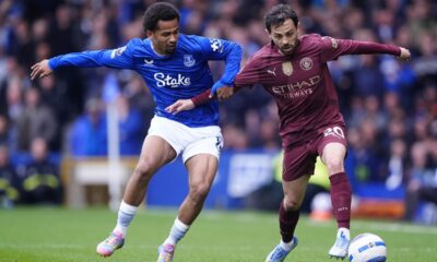 Everton's Iliman Ndiaye, left, and Manchester City's Bernardo Silva battle for the ball during the English Premier League soccer match between Everton and Manchester City at Goodison Park, Liverpool, England, Saturday April 19, 2025. (Peter Byrne/PA via AP)