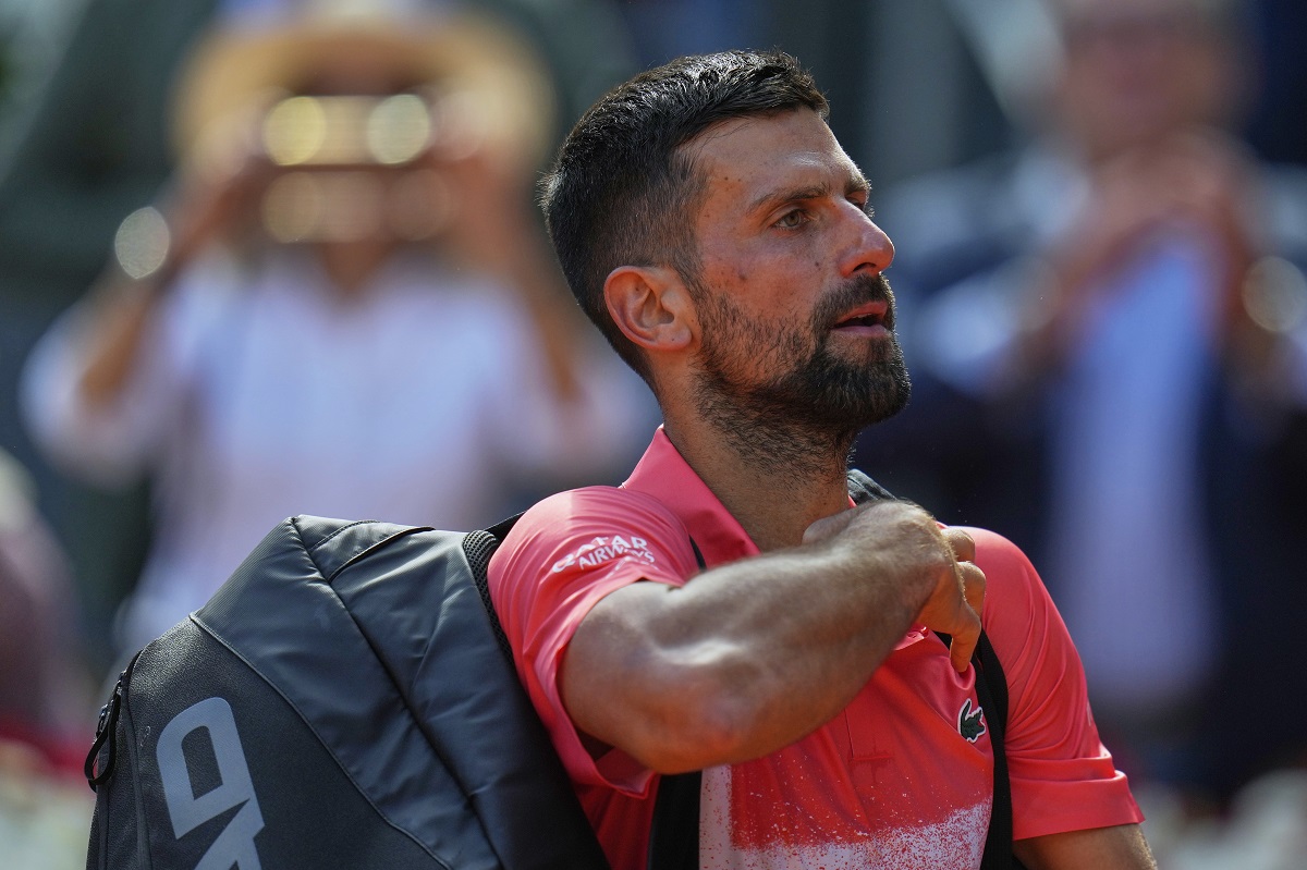 Novak Djokovic of Serbia leaves the court after losing against Matteo Arnaldi of Italy during the Madrid Open tennis tournament in Madrid, Spain, Saturday, April 26, 2025. (AP Photo/Manu Fernandez)