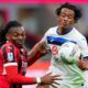 AC Milan's Rafael Leao, left, and Atalanta's Juan Cuadrado in action during the Serie A soccer match between Milan and Atalanta at San Siro Stadium in Milan, Italy, Sunday April 20, 2025. (Spada/LaPresse via AP)