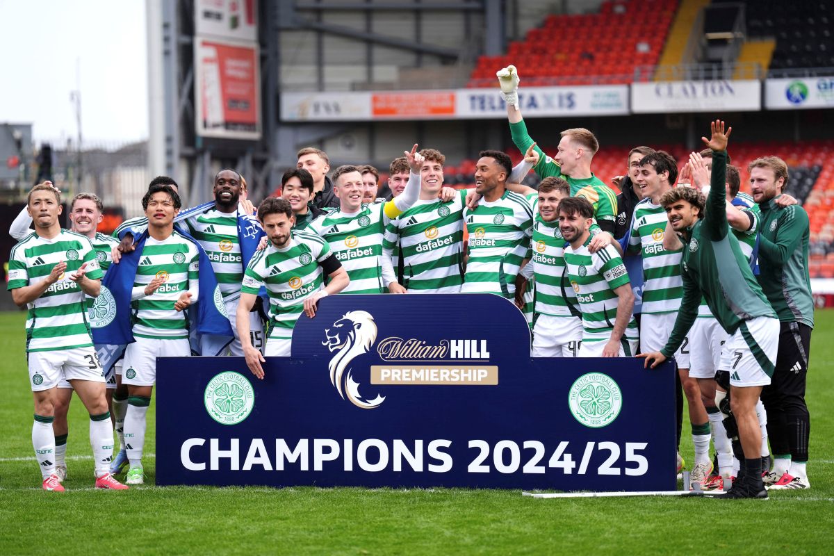 Celtic players celebrate victory in the William Hill Premiership following the William Hill Premiership match between Dundee United and Celtic at Tannadice Park, Dundee, Scotland, Saturday, April 26, 2025. (Andrew Milligan/PA via AP)