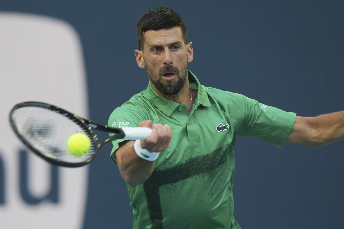 Novak Djokovic of Serbia hits a return to Sebastian Korda during the Miami Open tennis tournament, Thursday, March 27, 2025, in Miami Gardens, Fla. (AP Photo/Marta Lavandier)