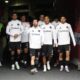 Inter Miami forward Lionel Messi, center, waves to fans as he enters the field with teammates before an MLS soccer game against the Chicago Fire, Sunday, April 13, 2025, in Chicago. (AP Photo/David Banks)