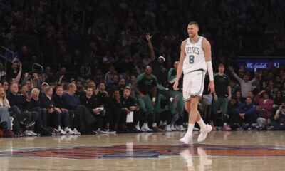 Boston Celtics' Kristaps Porzingis reacts after scoring a three point basket during the second half of an NBA basketball game against the New York Knicks, Tuesday, April 8, 2025, in New York. (AP Photo/Pamela Smith)