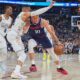 Los Angeles Clippers guard Bogdan Bogdanovic, right, struggles to drive to the basket as Denver Nuggets guard Russell Westbrook defends in the second half of Game 5 of an NBA basketball playoff series Tuesday, April 29, 2025, in Denver. (AP Photo/David Zalubowski)