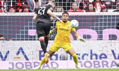 Berlin's Andrej Ilic, left, scores his side's second goal during the German Bundesliga soccer match between SC Freiburg - 1. FC Union Berlin at The Europa-Park Stadion in Freiburg, Germany, Sunday, March 30, 2025. (Harry Langer/dpa via AP)