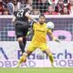 Berlin's Andrej Ilic, left, scores his side's second goal during the German Bundesliga soccer match between SC Freiburg - 1. FC Union Berlin at The Europa-Park Stadion in Freiburg, Germany, Sunday, March 30, 2025. (Harry Langer/dpa via AP)